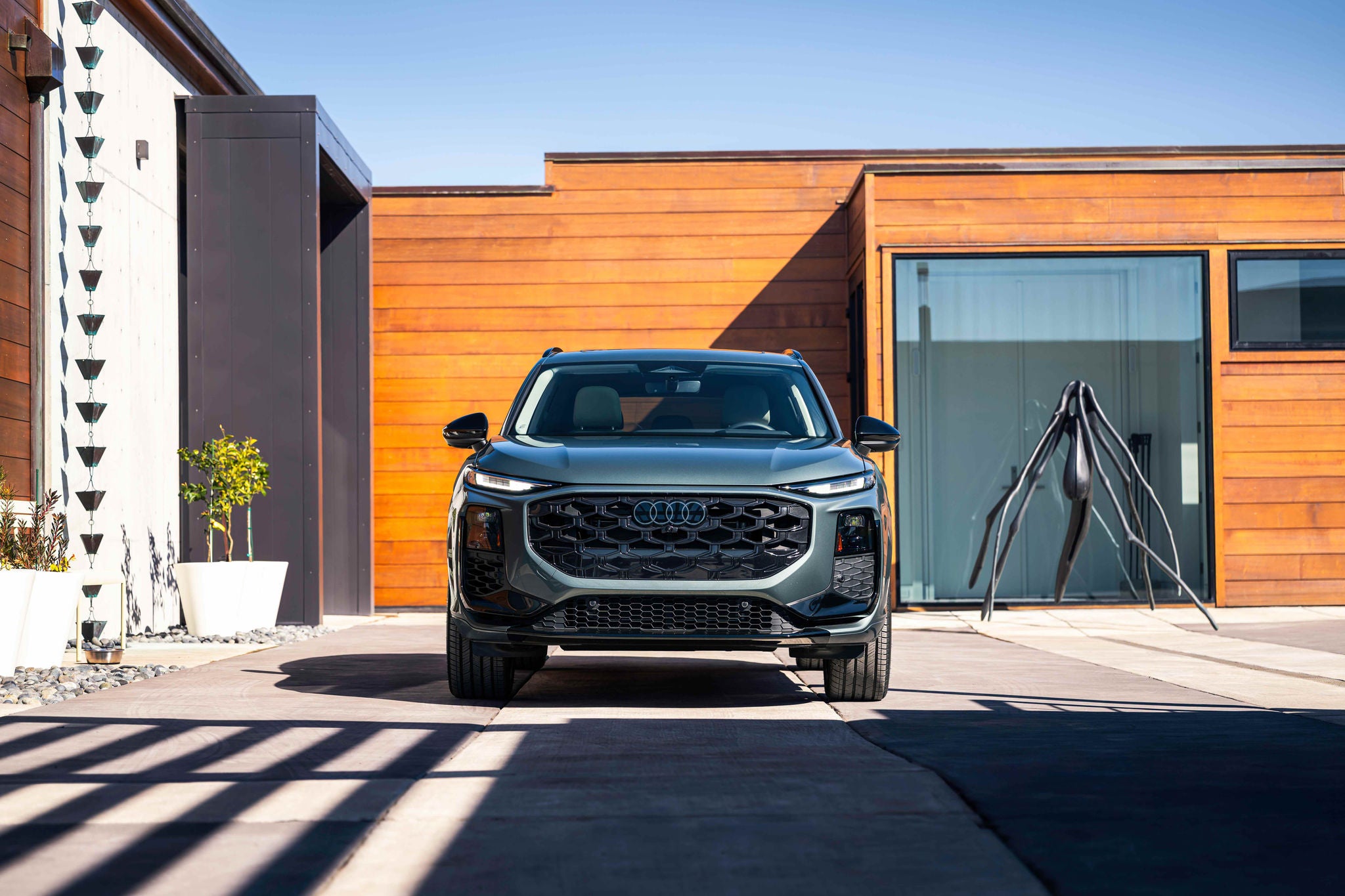 Wide front profile view of an Audi Q3 parked.